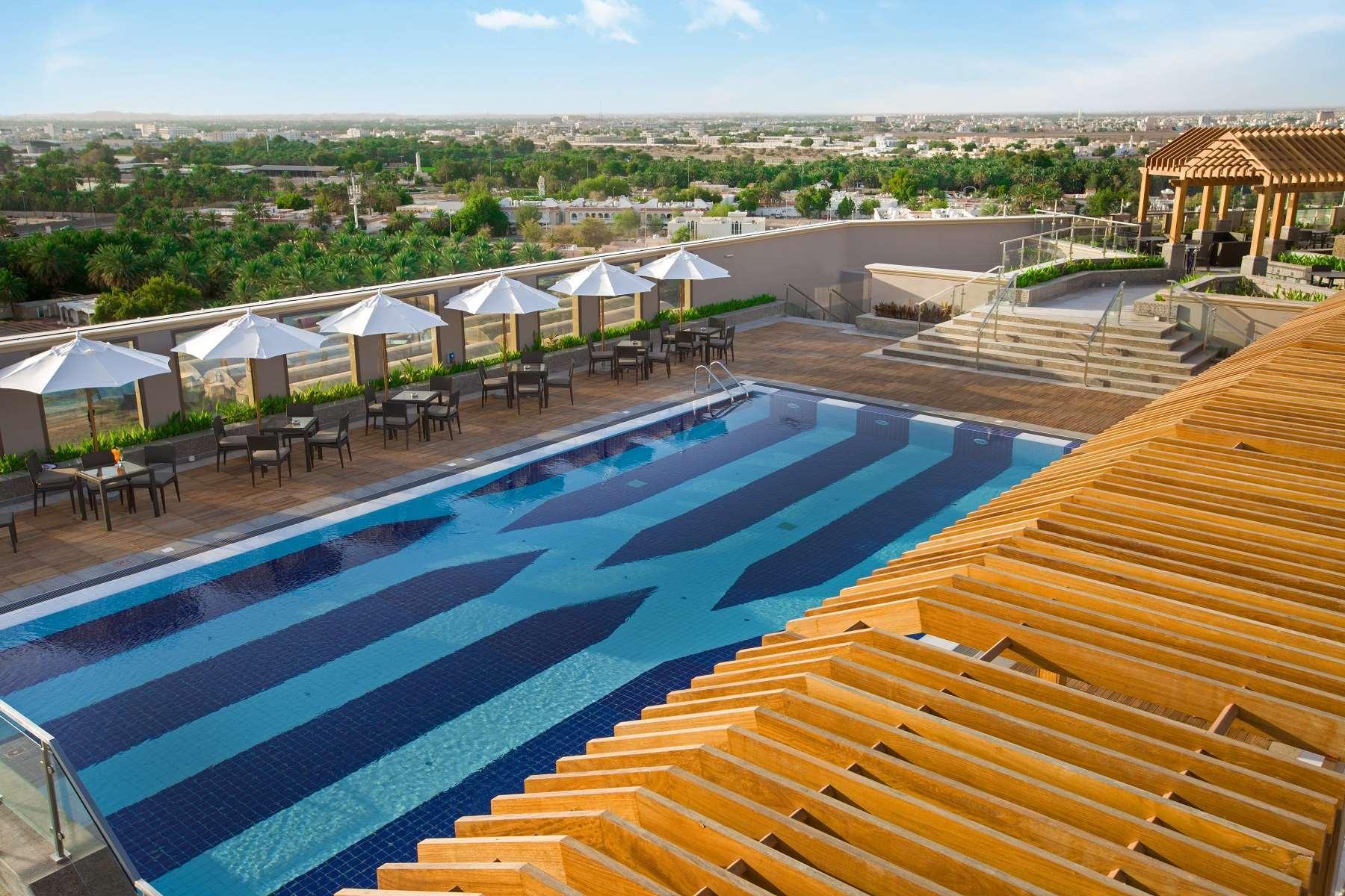 Ayla Grand Hotel al-Ain Exterior foto The pool at the hotel