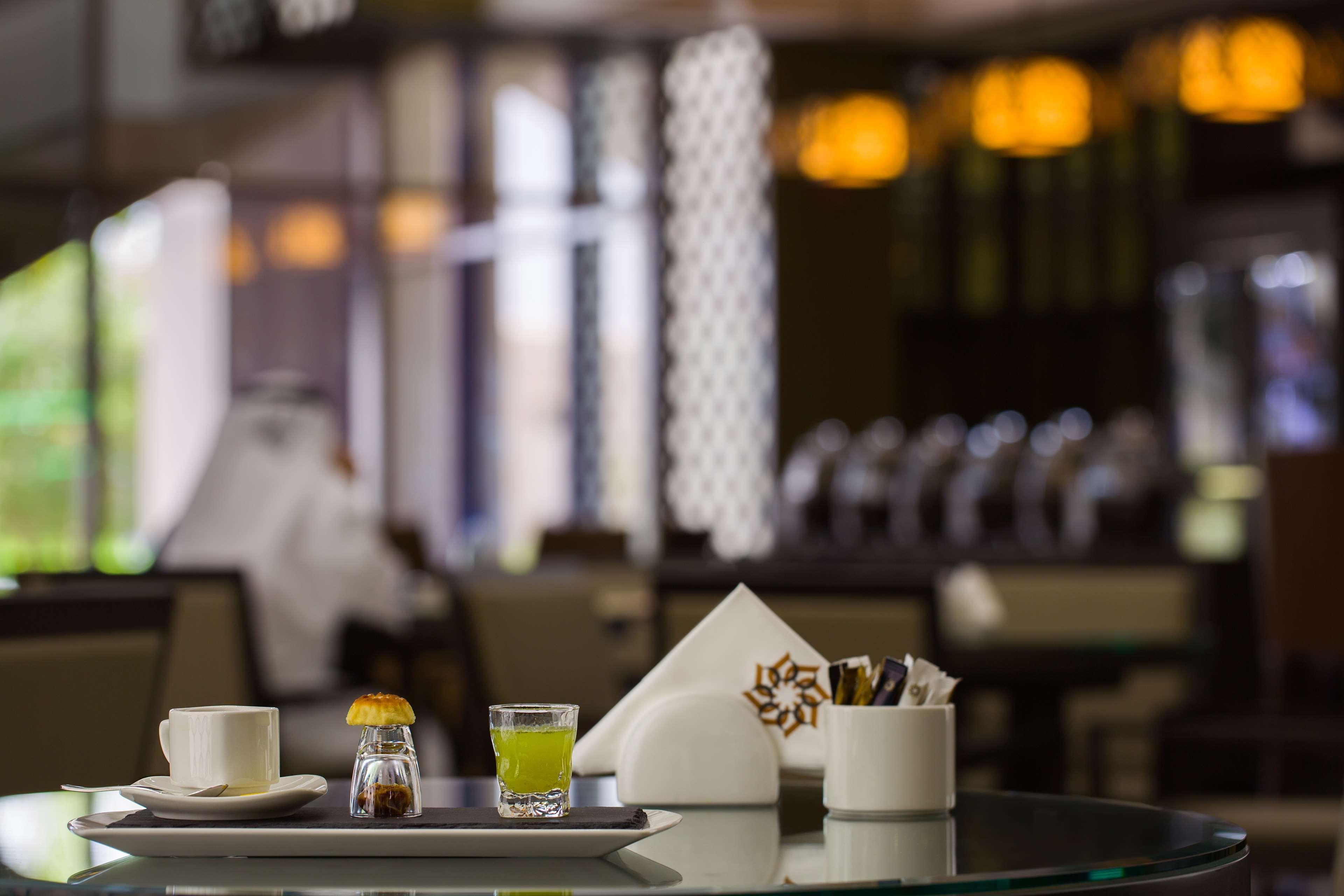 Ayla Grand Hotel al-Ain Exterior foto A table set for service